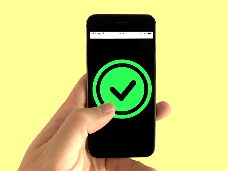 Smartphone screen with verifying tick